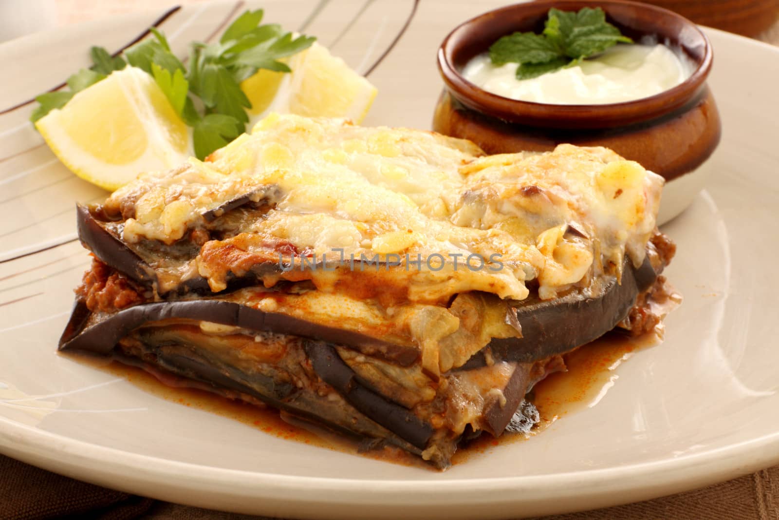 Delicious Greek moussaka with aubergine and a side garden salad.