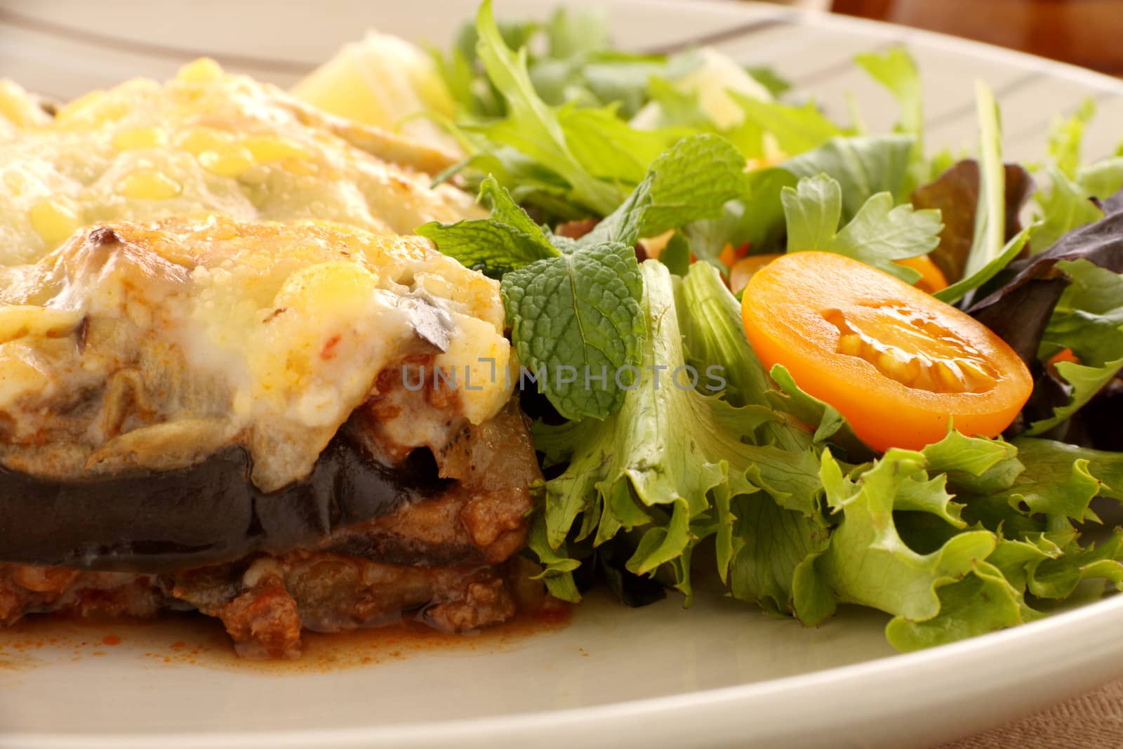 Delicious Greek moussaka with aubergine and a side garden salad.