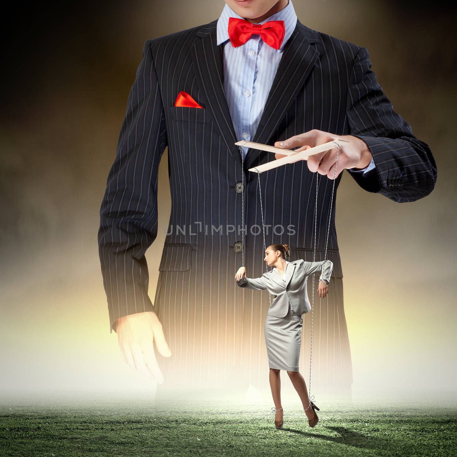 Image of young businessman puppeteer. Leadership concept