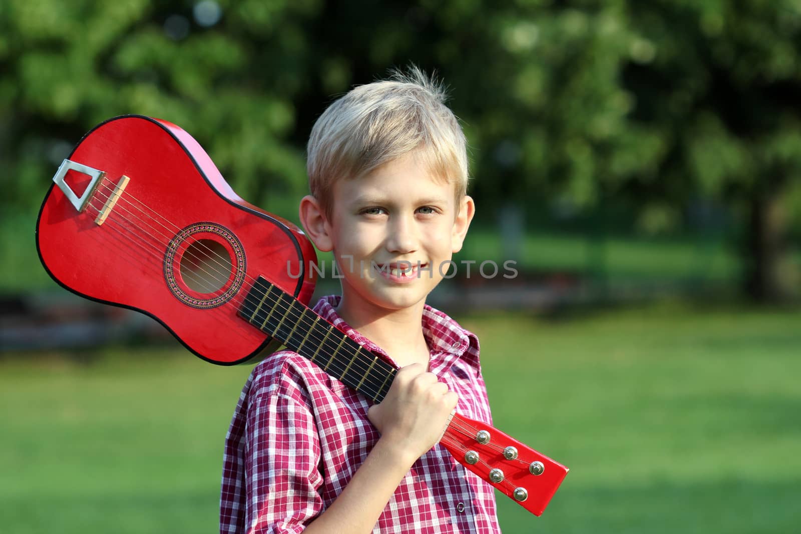 happy boy with guitar portrait by goce