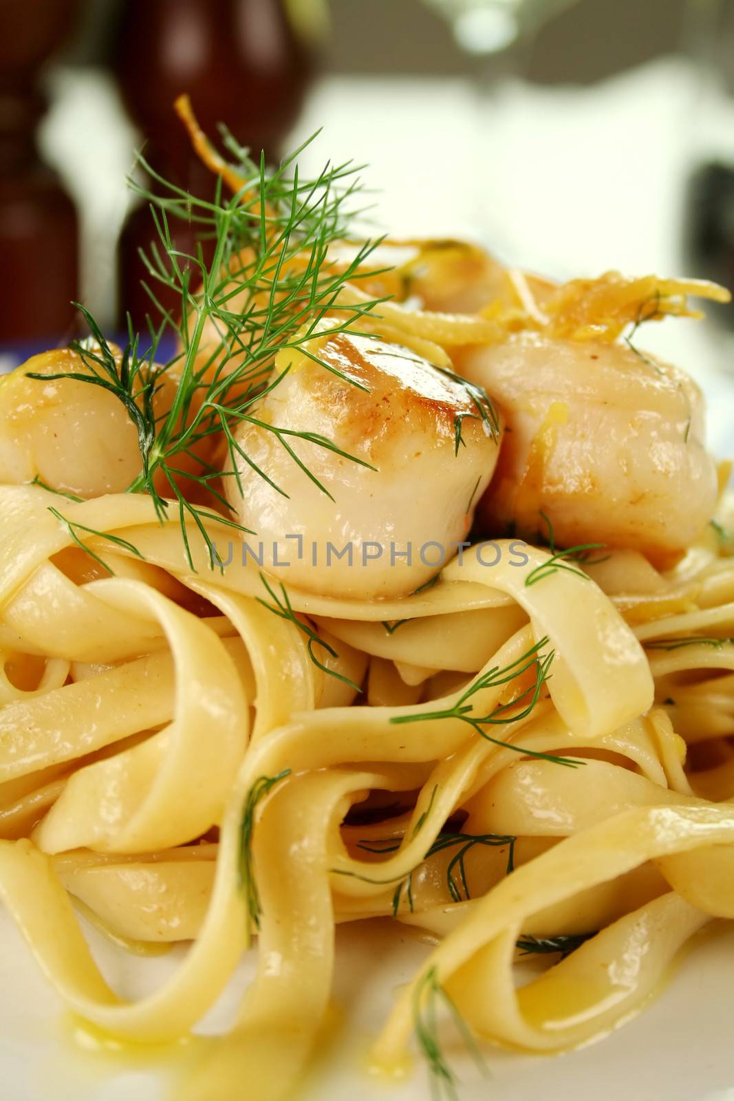 Fettucini with caramelized lemon and dill sea scallops.