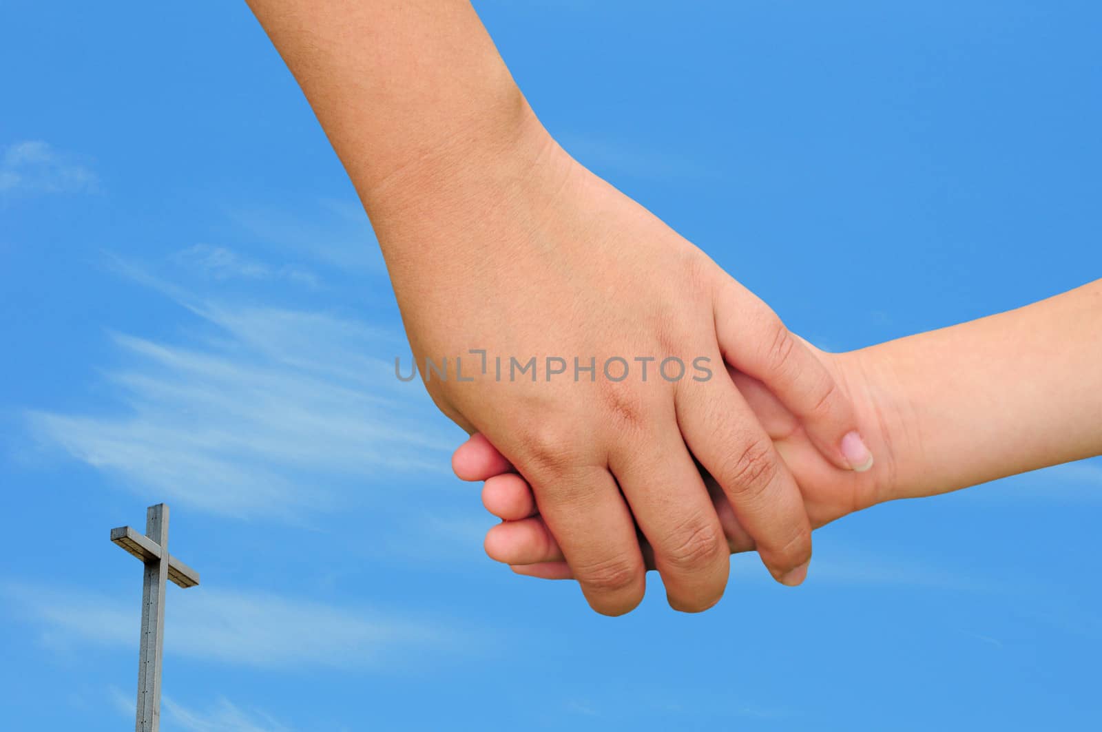 Christian family concept with mom holding the hand of a child