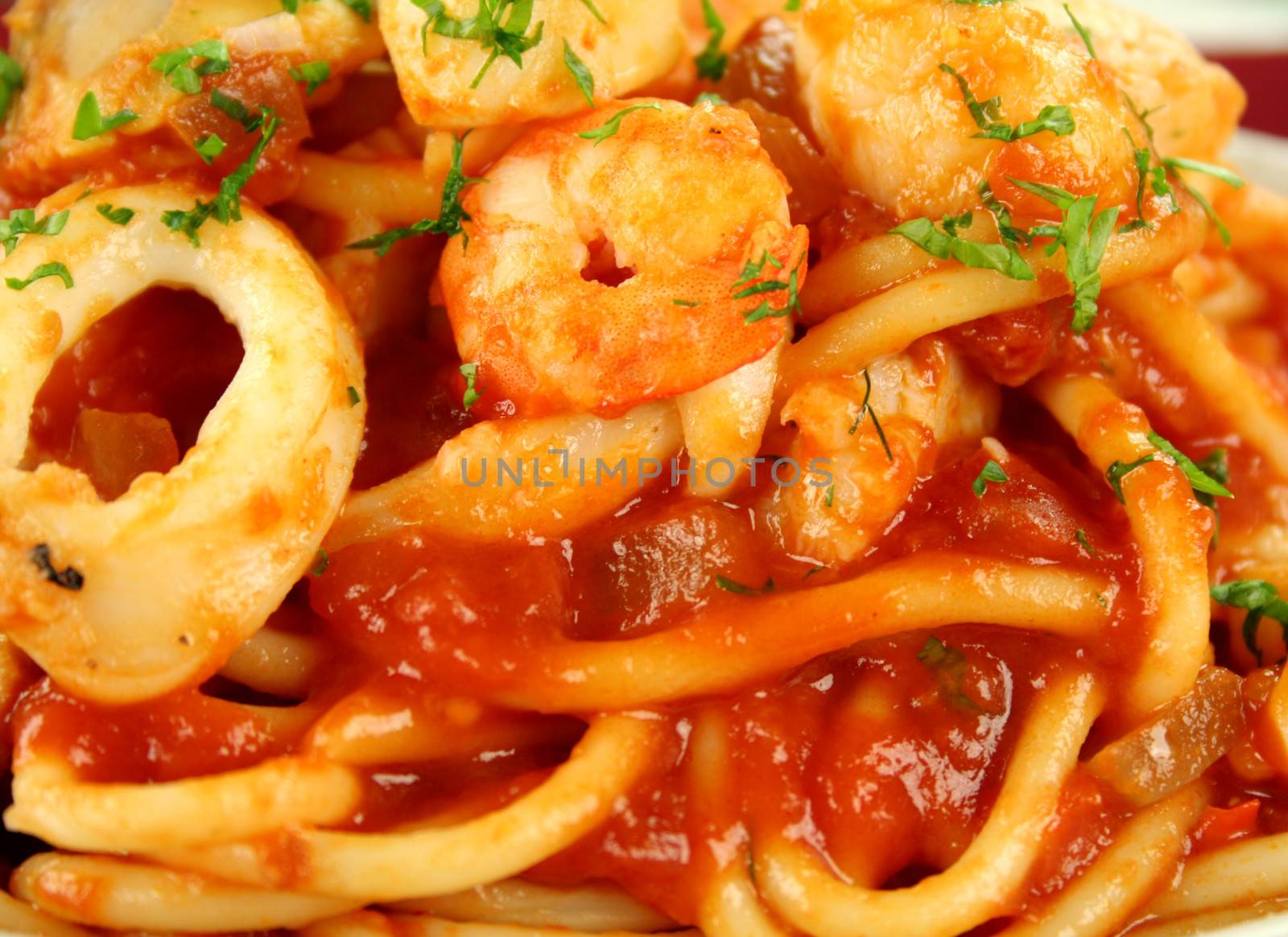 Delicious spaghetti marinara with fish, shrimps, calamari and mussels with a spicy tomato sauce.