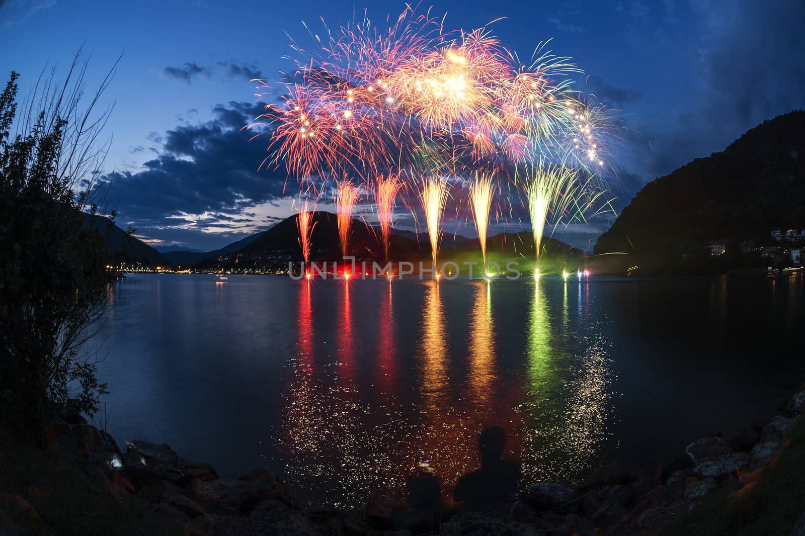 Fireworks on the Lugano Lake in a summer evening