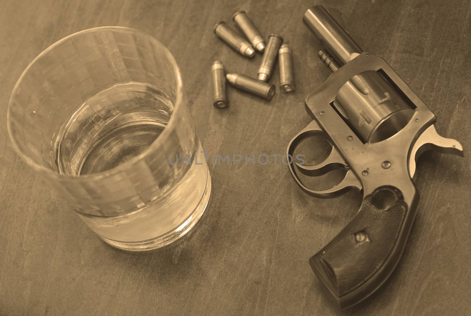 bullets, booze and a gun for a deadly combination in sepia