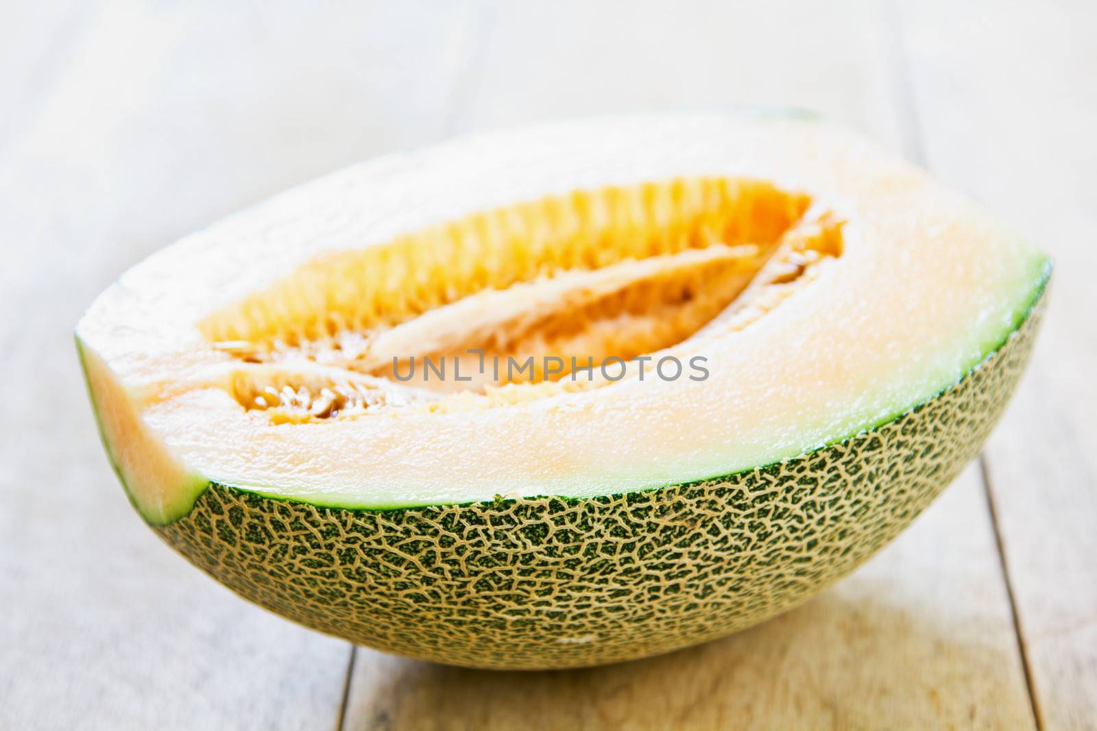 Halve Cantaloupe on wood board