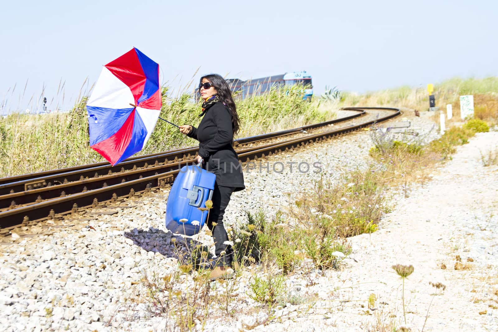 Young woman desperately running after the train