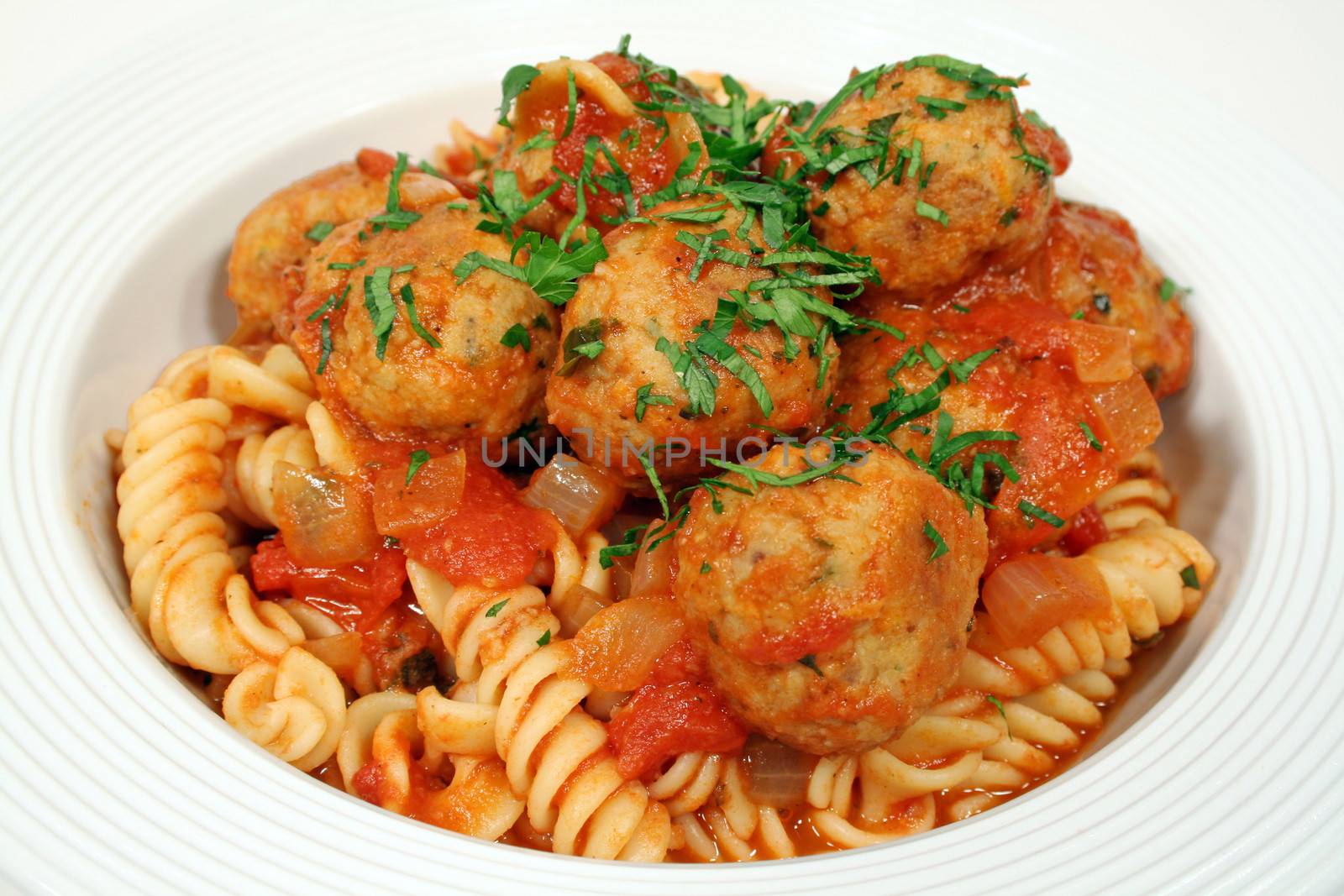 Pasta with chicken meat balls and a delicious Italian  tomato sauce.