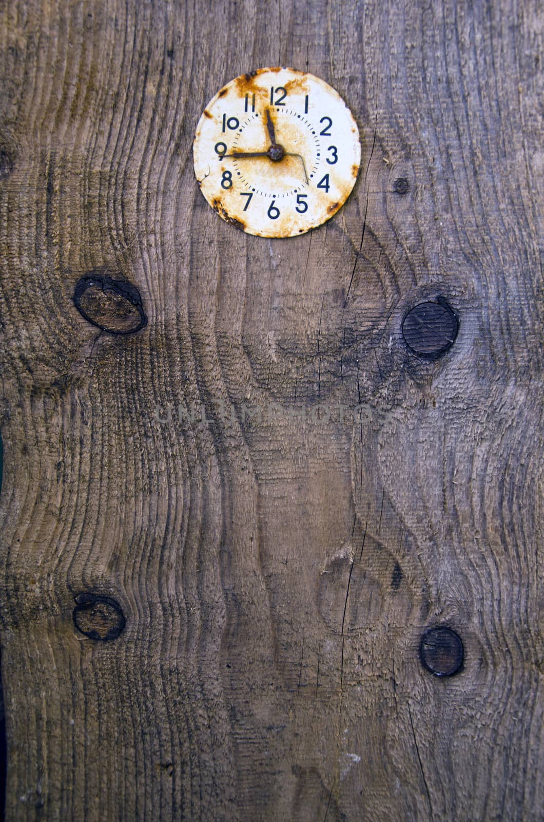 old wooden plank background with ancient clock face
