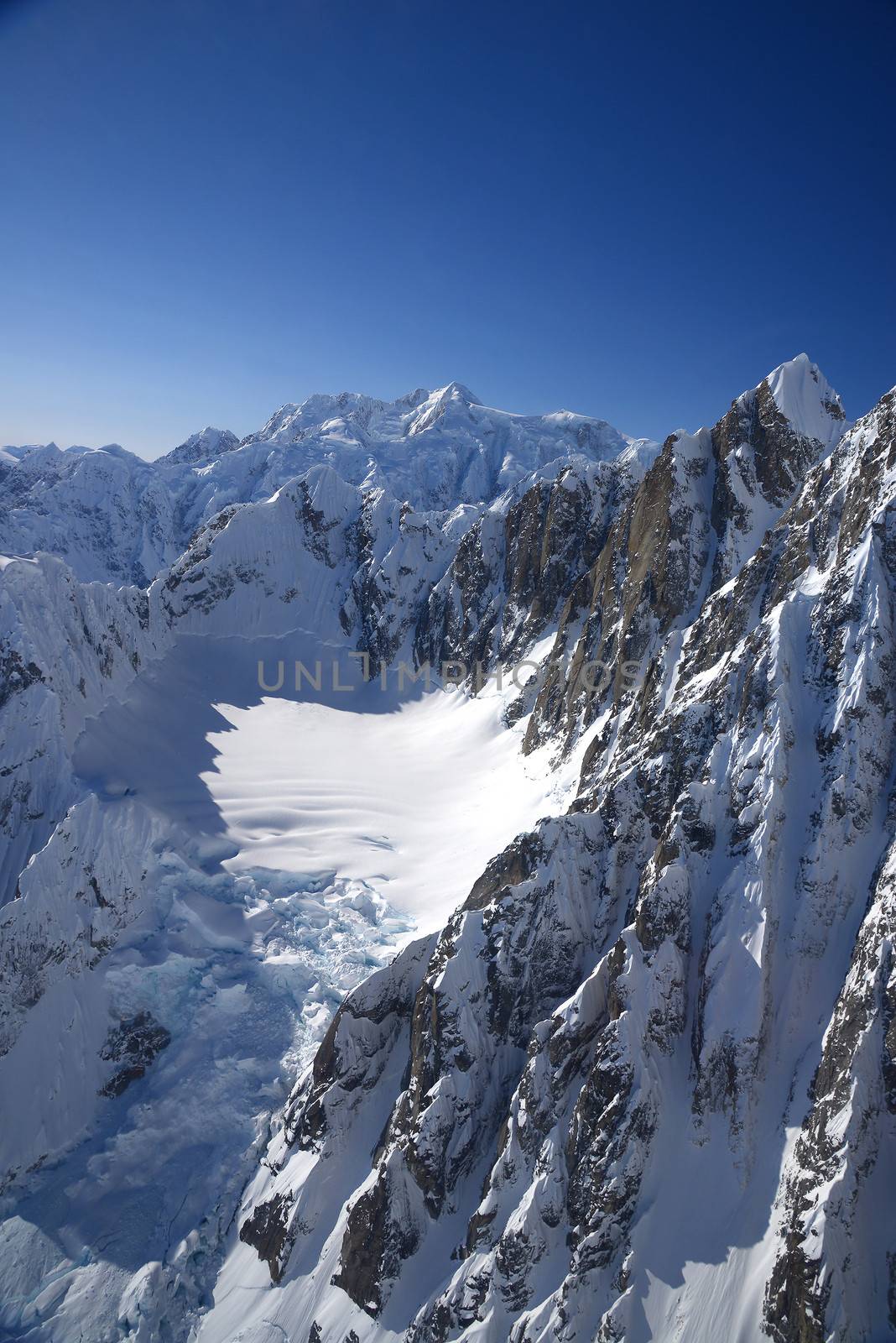 alaskan mountain cover with snow as seen from plane