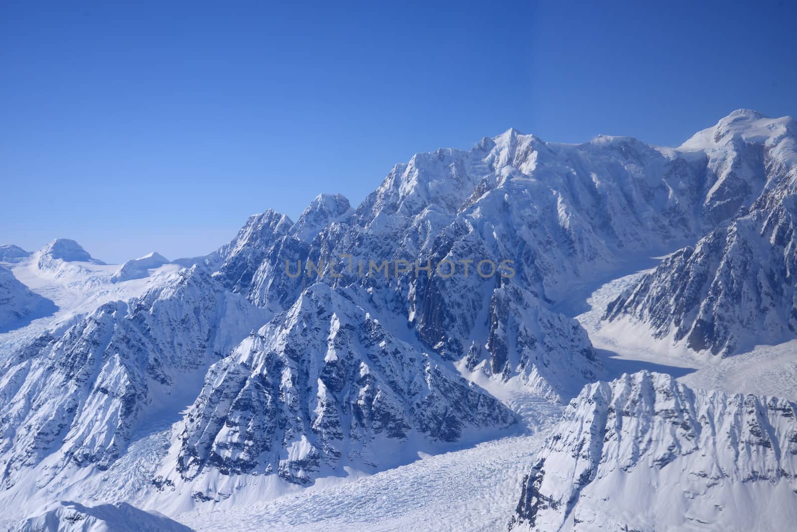 alaskan mountain cover with snow as seen from plane