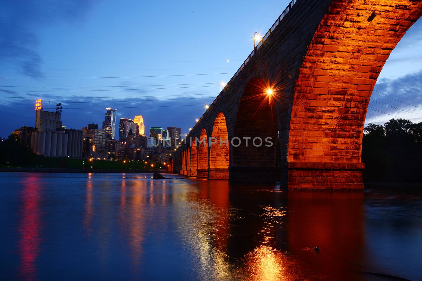 a historic bridge near minneapolis downtown in evening