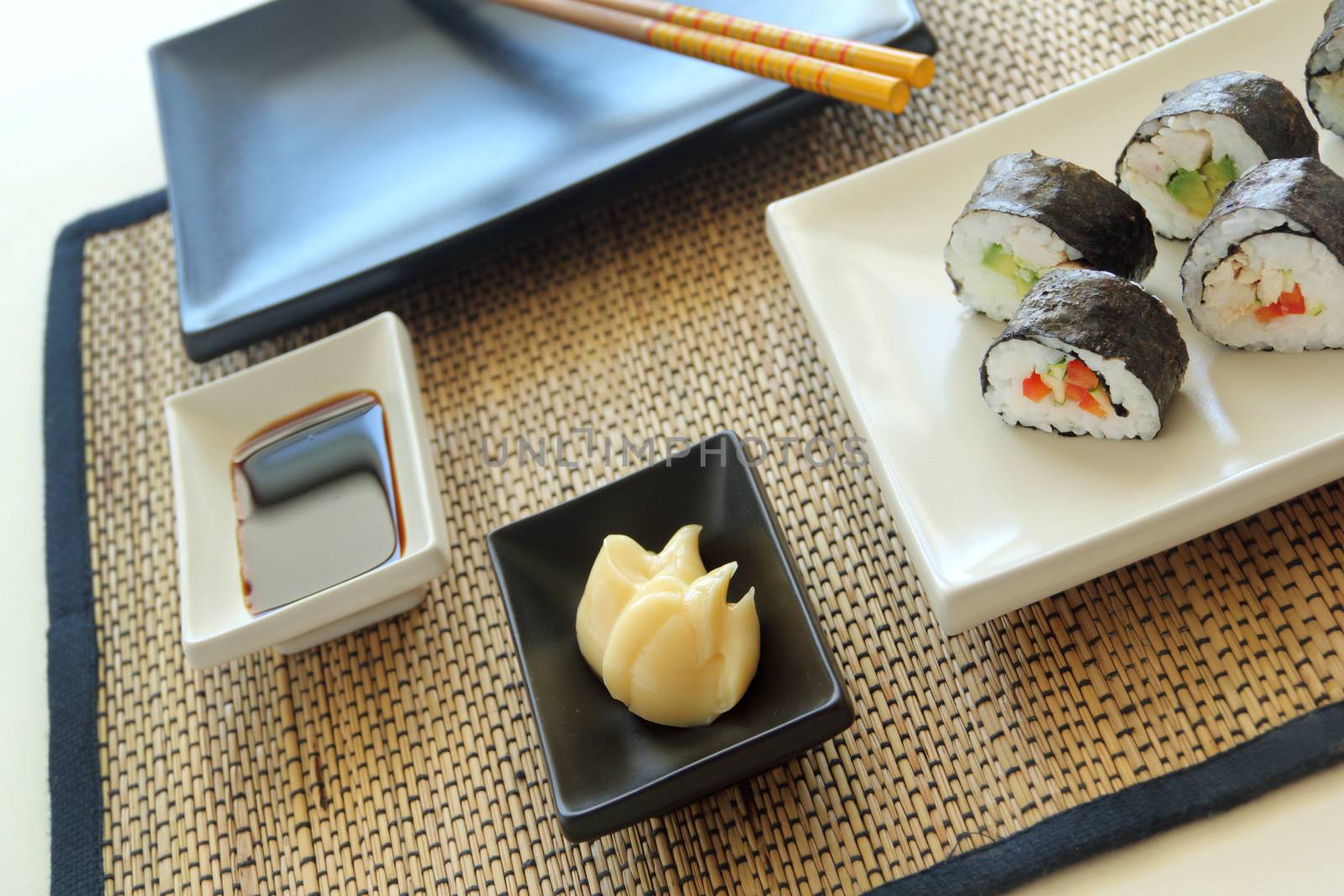 Chicken sushi with soy sauce and mayonnaise ready to serve.