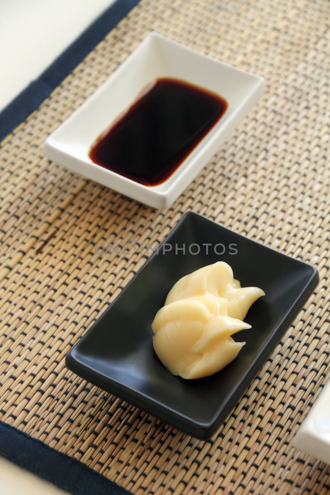Japanese condiments comprising soy sauce and Japanese mayonnaise as dipping sauces.