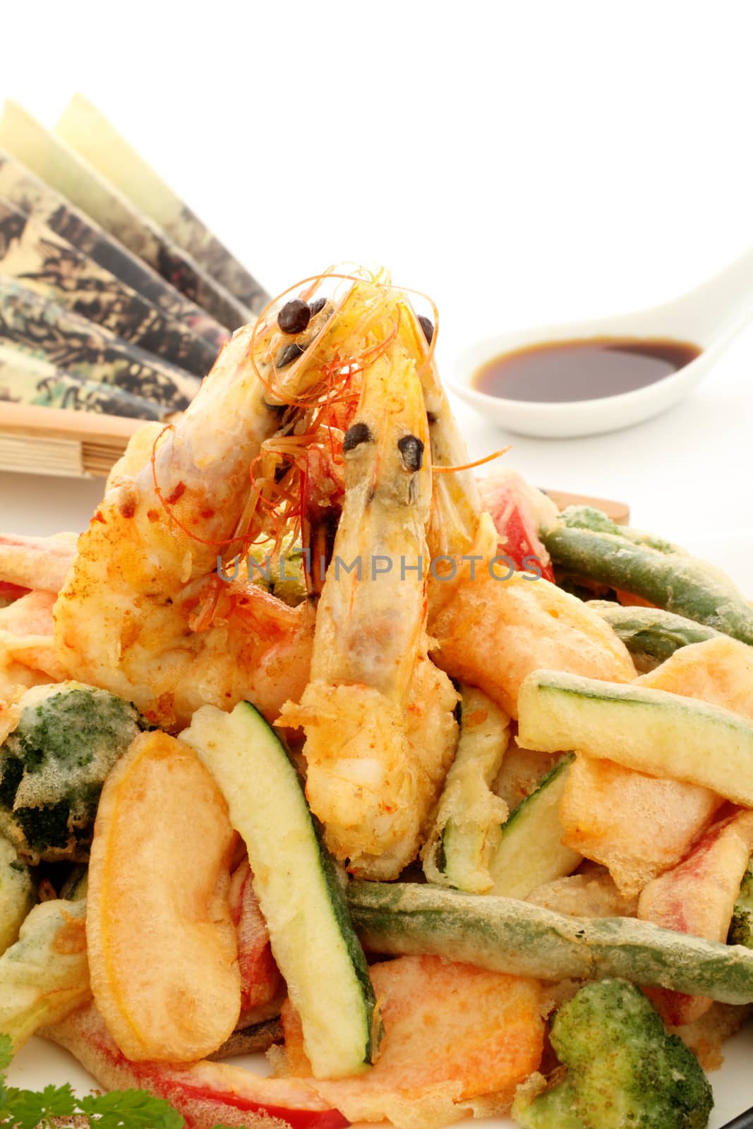 Japanese fried tempura with shrimp and vegetables with soy sauce.