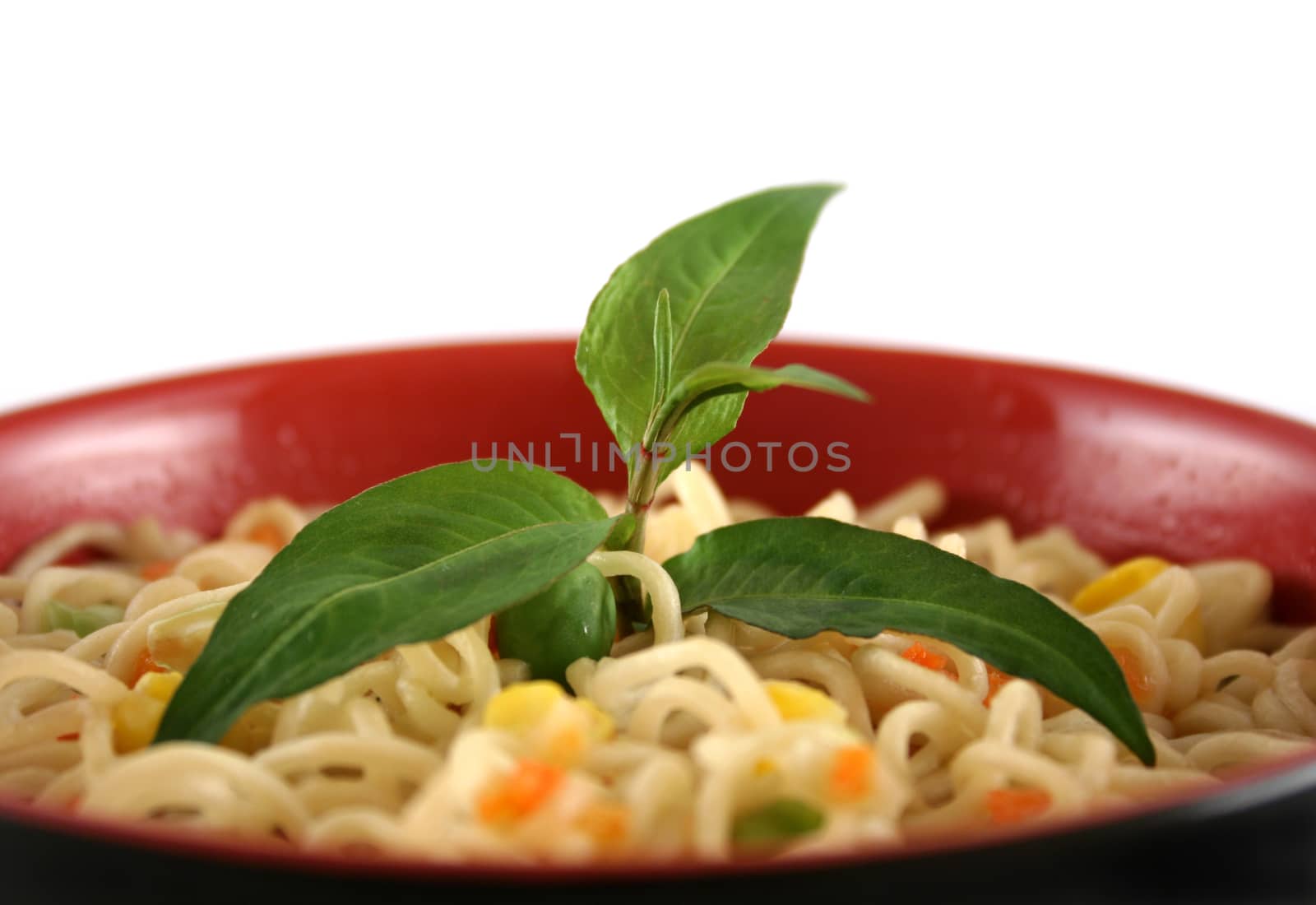 Fresh Vietnamese mint with a bowl of noodles.