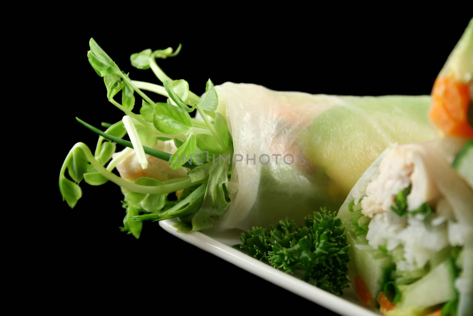 Healthy Vietnamese rice paper roll with chicken and vegetables.