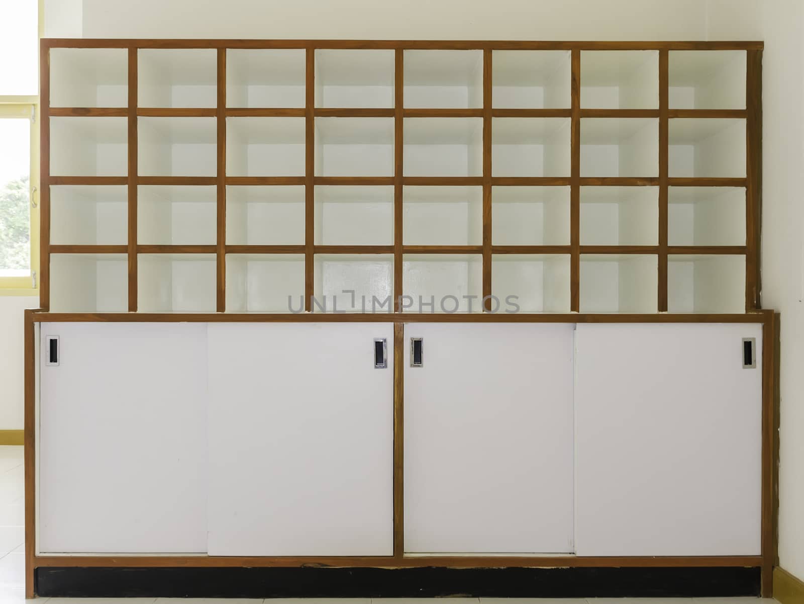 Beautiful white wood shelves with tableware and decor