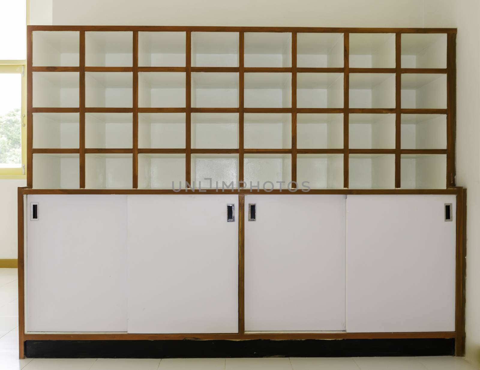 Beautiful white wood shelves with tableware and decor