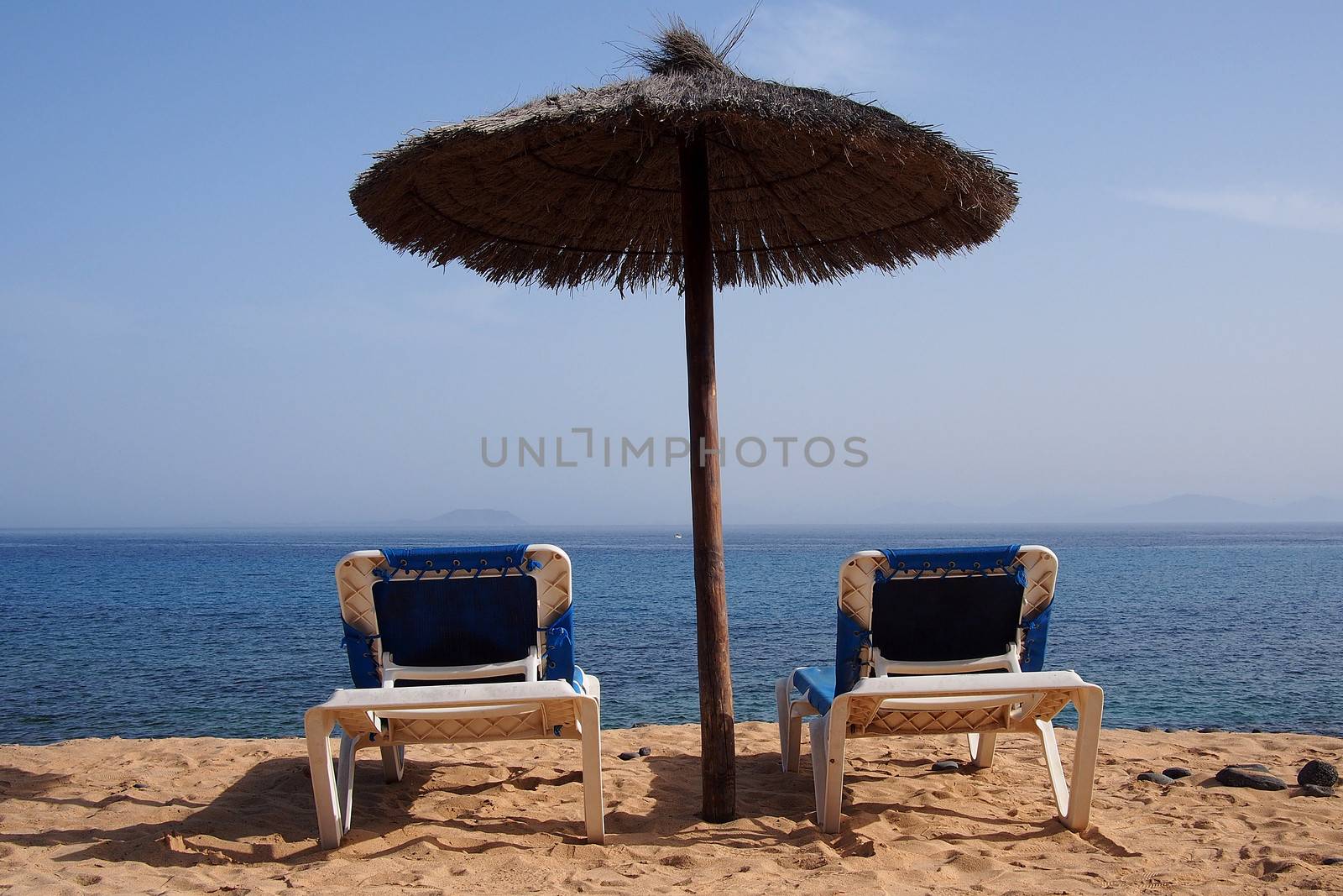 Relaxing area nearby sandy beach by stockyimages