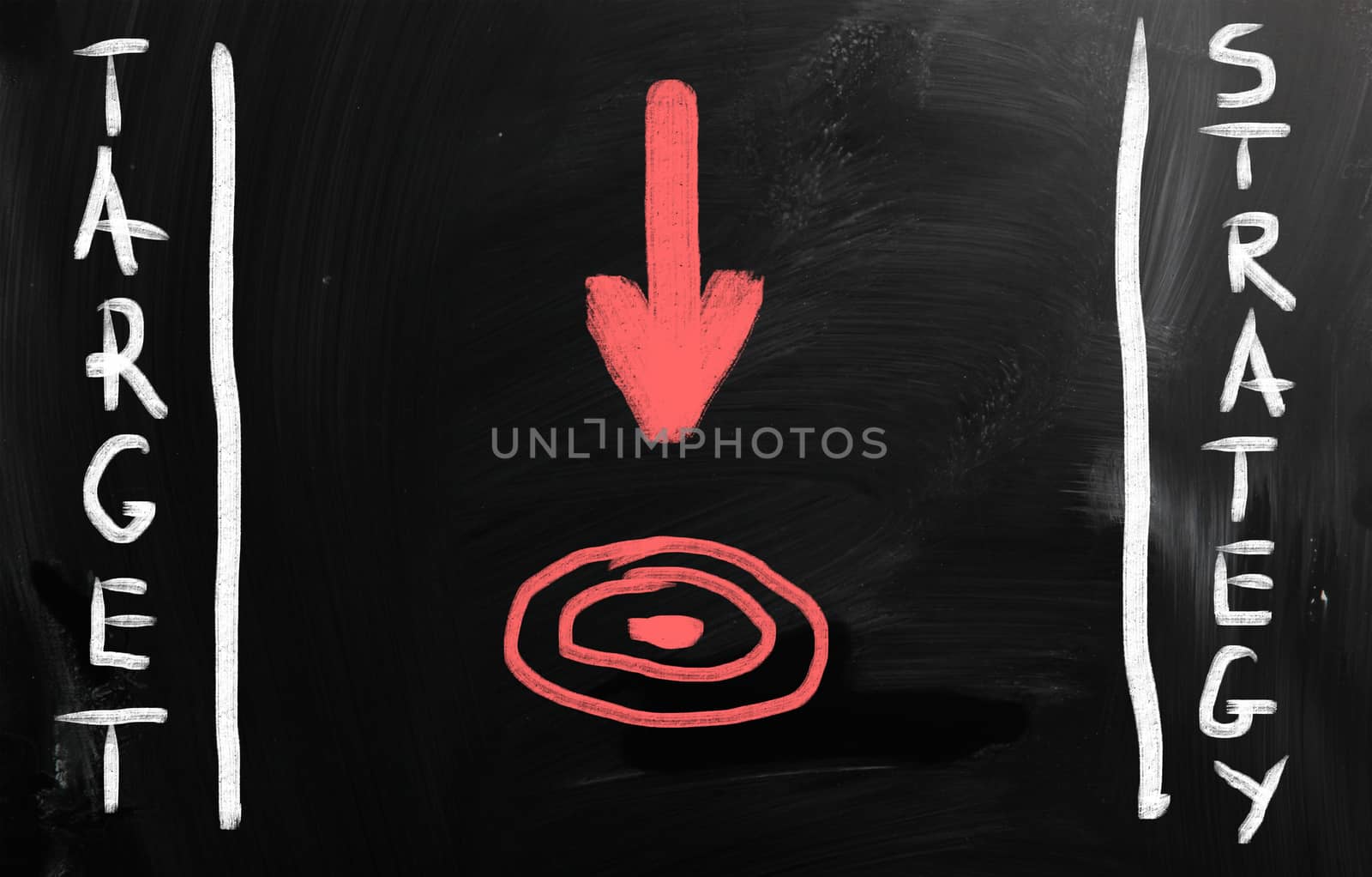 "Strategy" handwritten with white chalk on a blackboard.