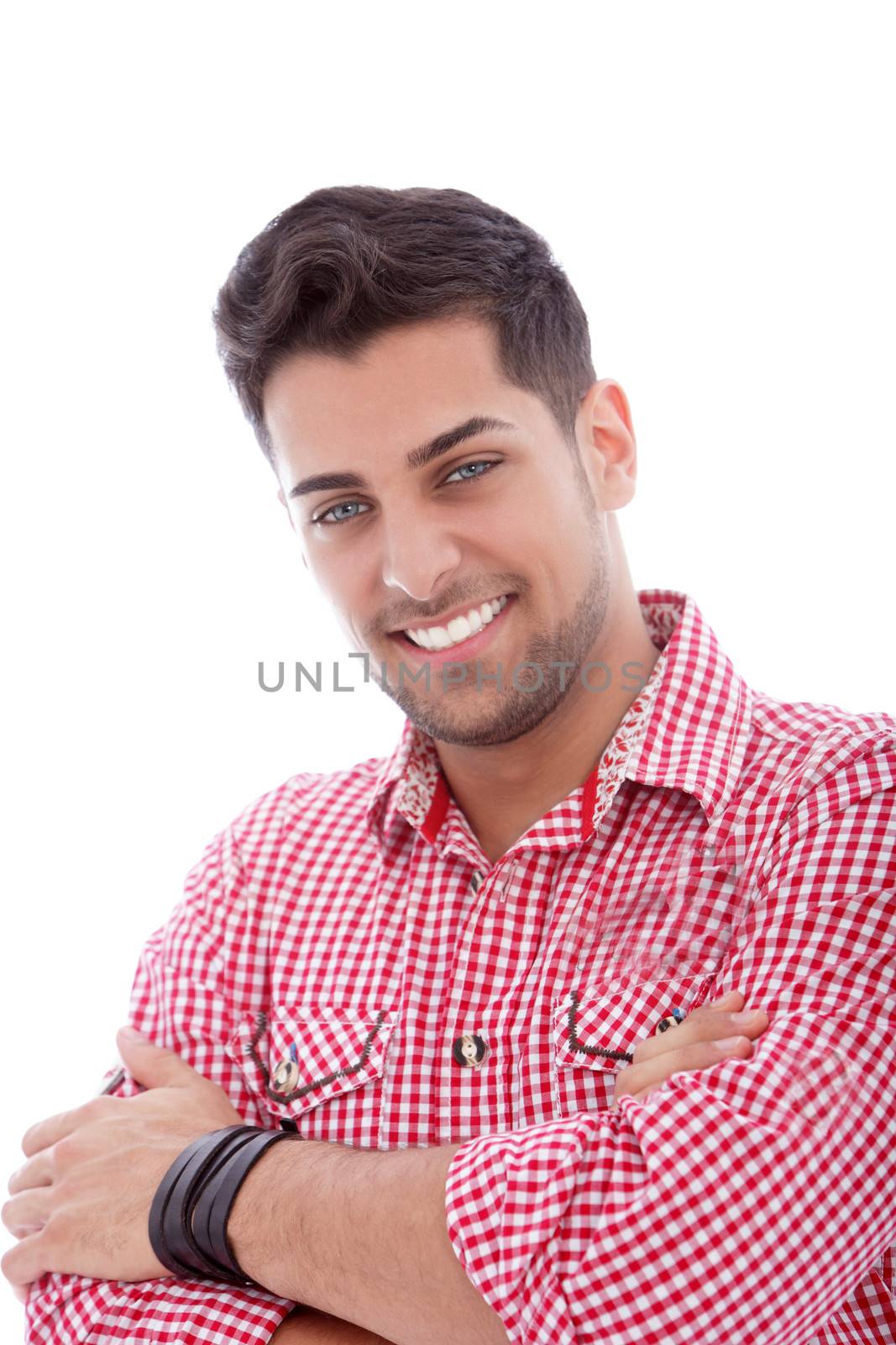 Handsome young male posing with arms crossed in a close up portrait