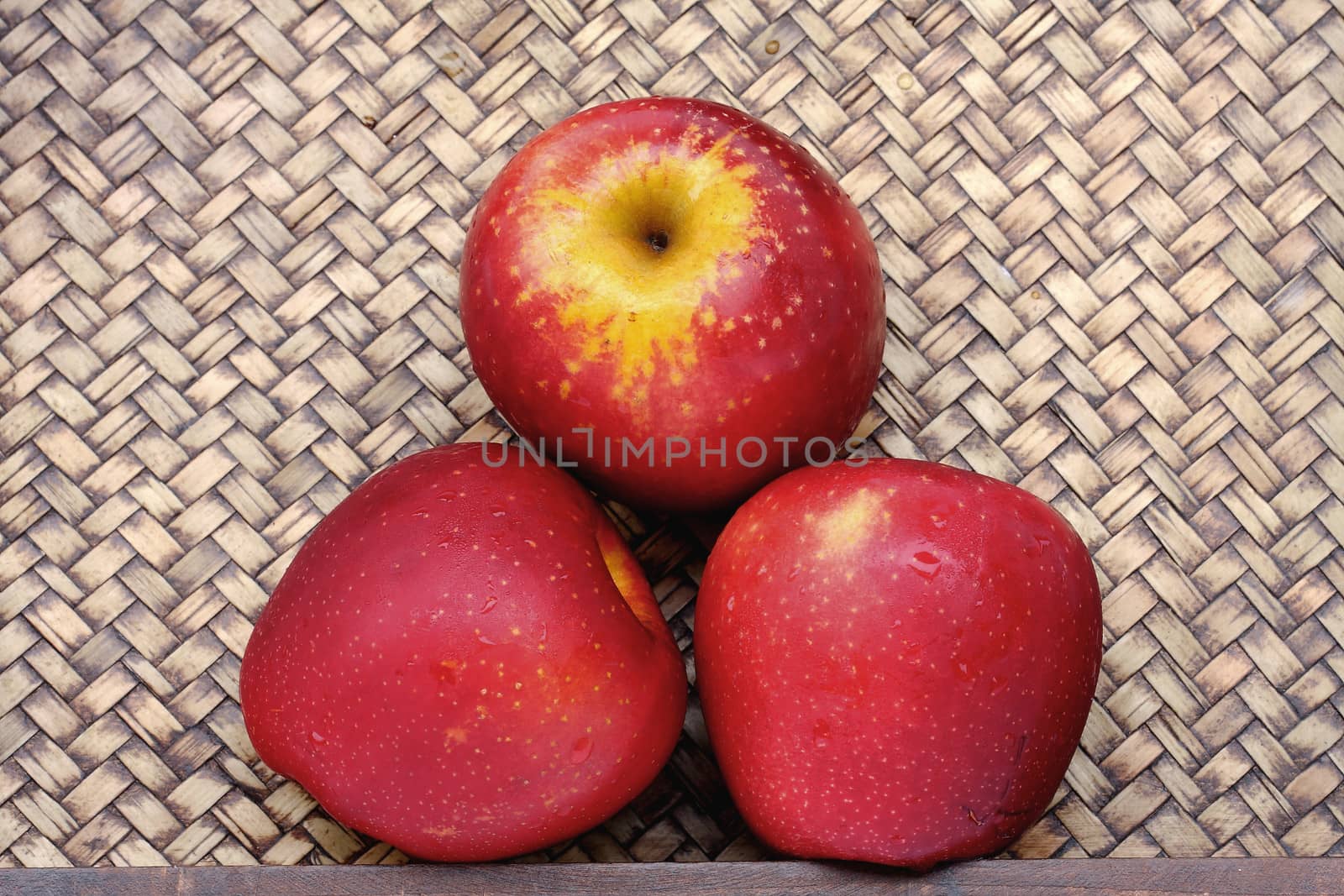 Three apples on bamboo by myrainjom01