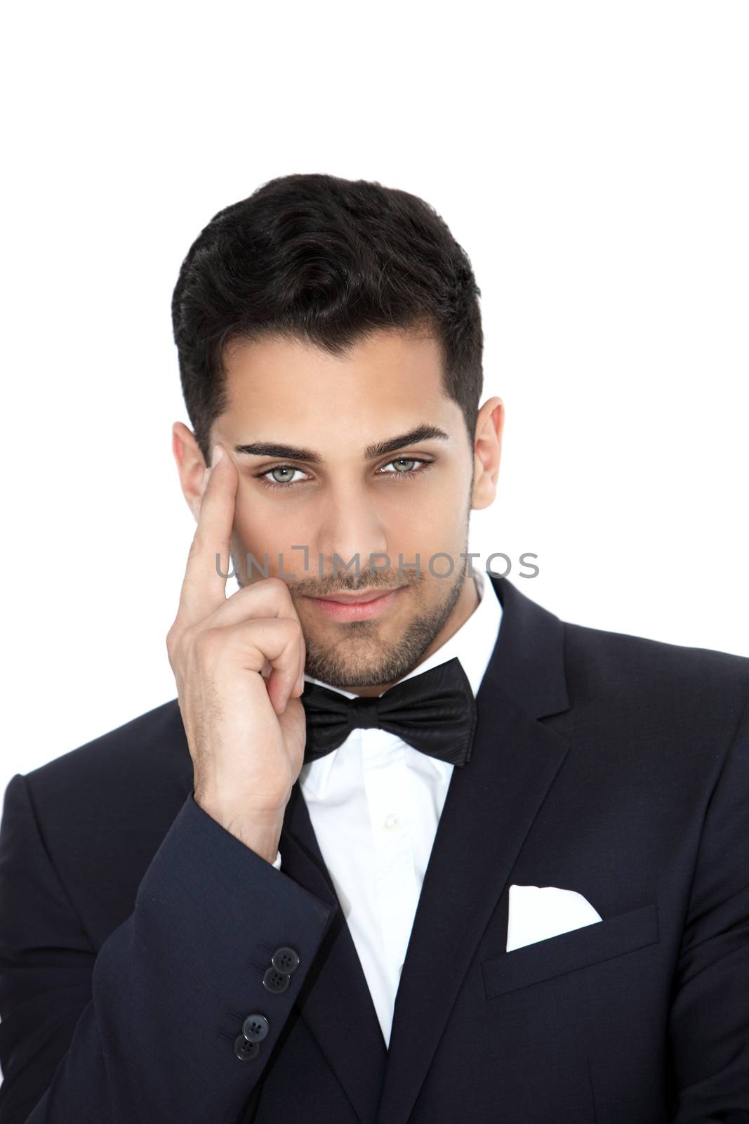 Young cheerful groom looking in a front view shot