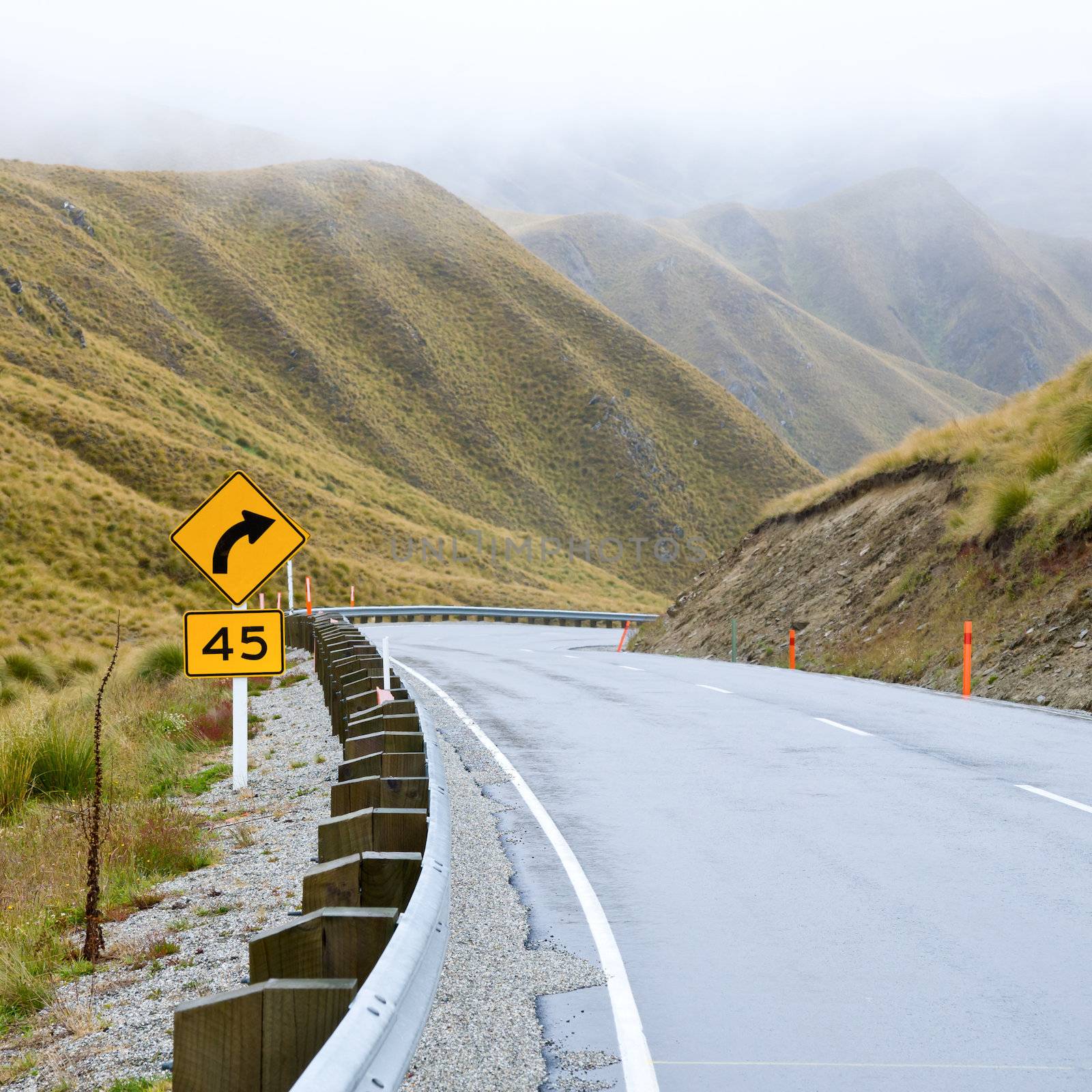 Mountain road in the Southern Alps of New Zealand on a foggy day