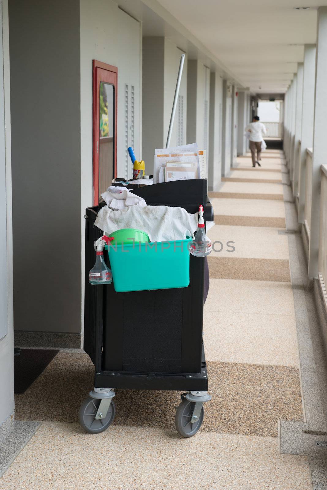 The hotel cleaning tool cart of housekeeper are on the walkway