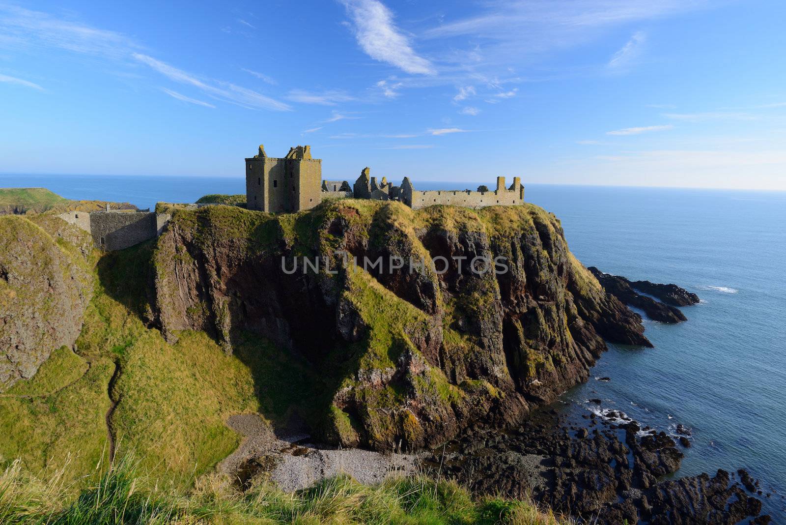 Dunnottar Castle  with blue sky background in Aberdeen, Scotland.