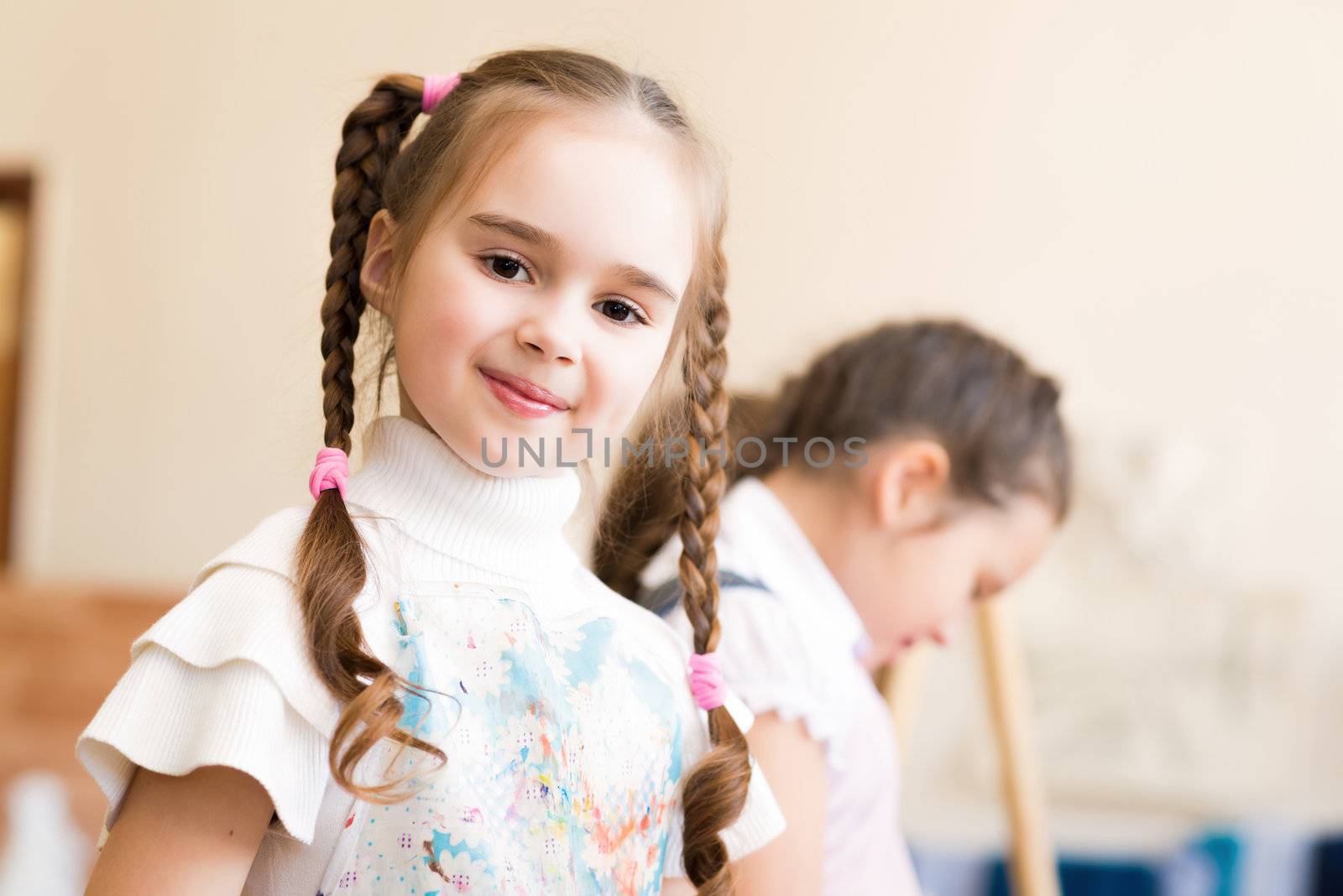 portrait of a girl in an apron, the kids involved in art school