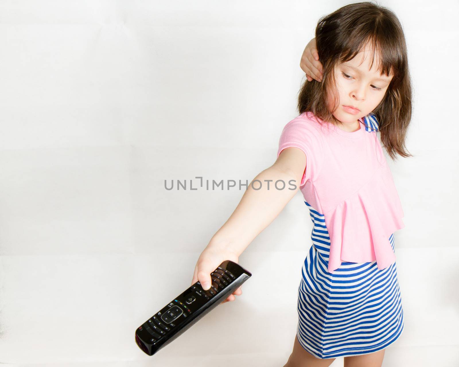 Asian child with remote control by imagesbykenny