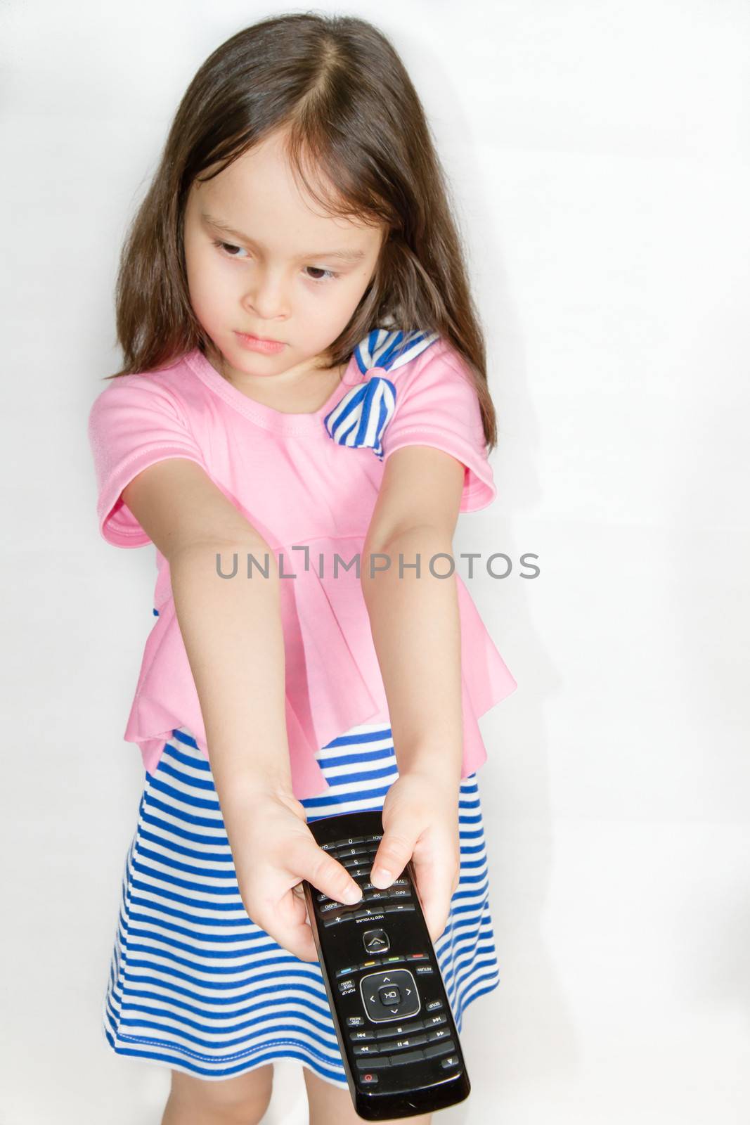 Asian child with remote control by imagesbykenny