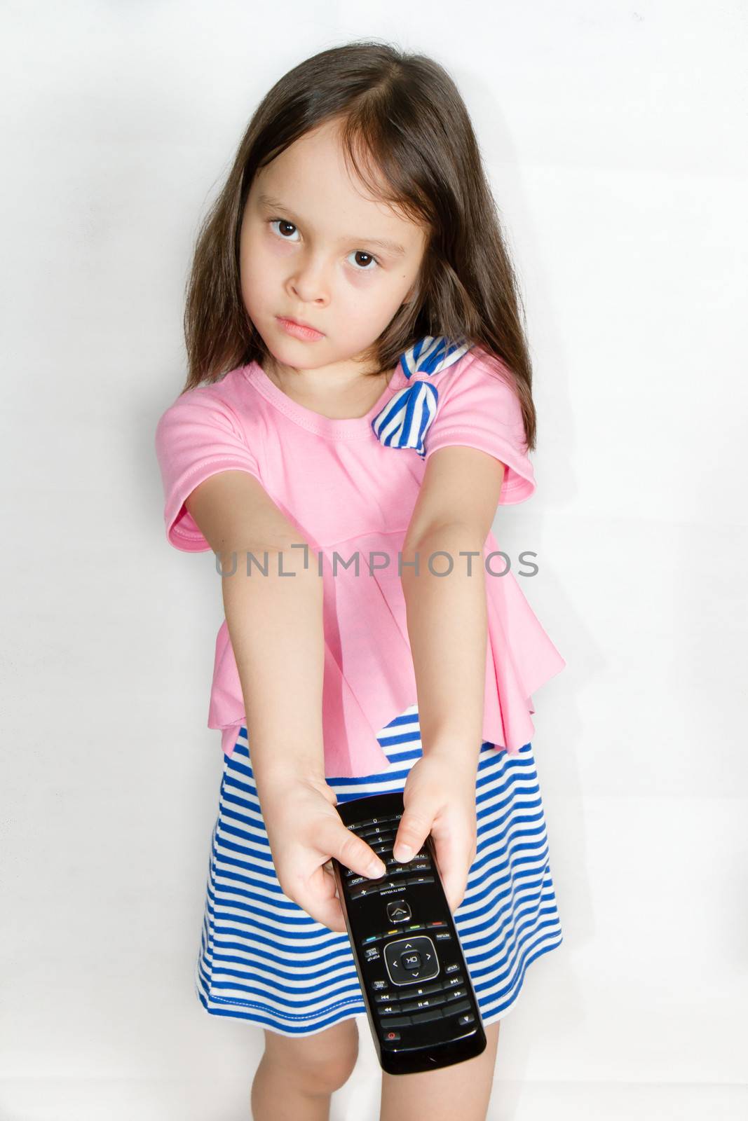 Asian child with remote control by imagesbykenny