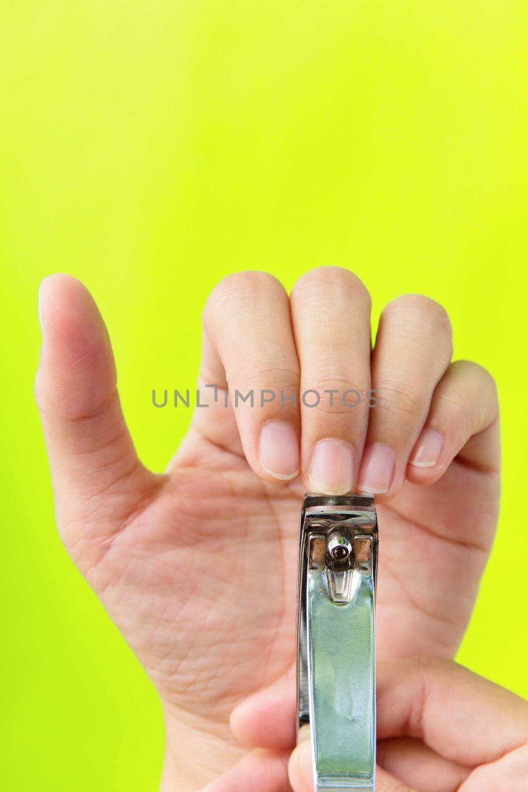 hand manicure with nail clipper