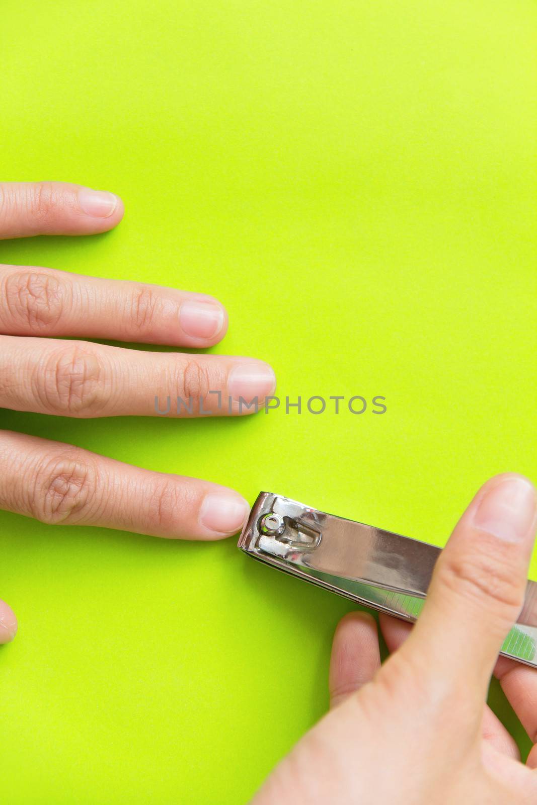 hand manicure with nail clipper by ponsulak