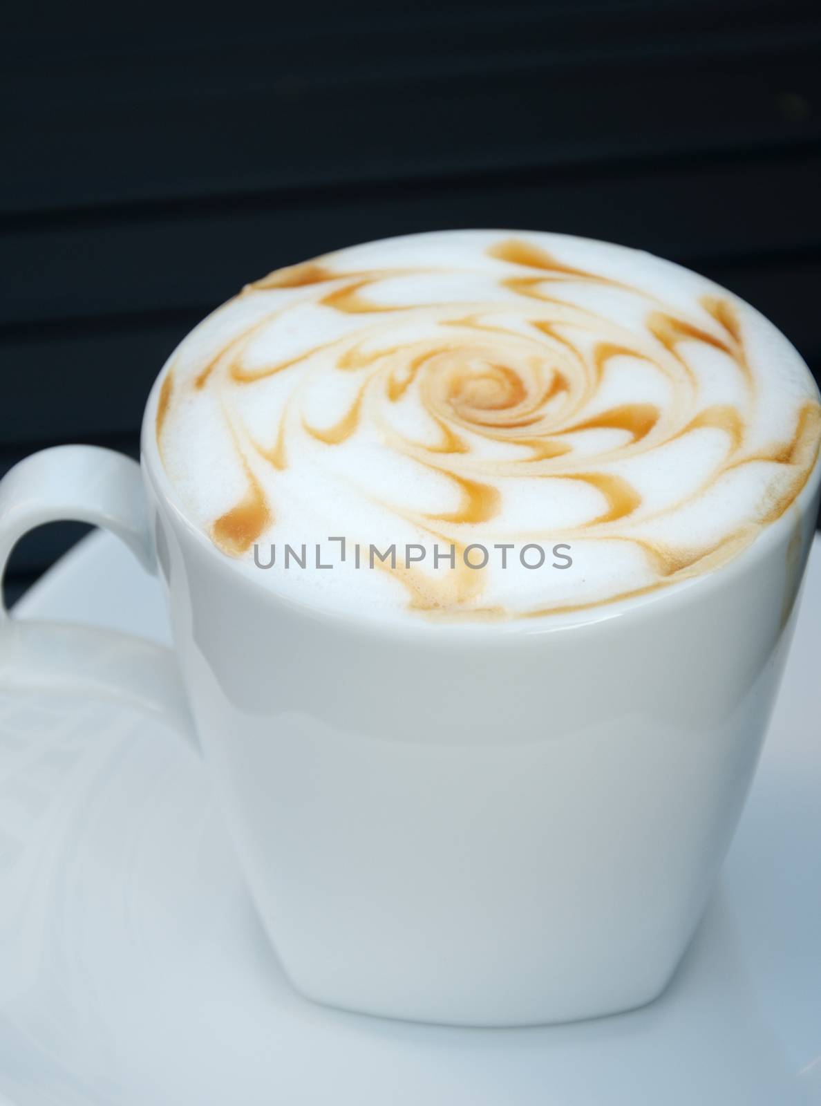 Hot coffee on table in cafe by pixbox77