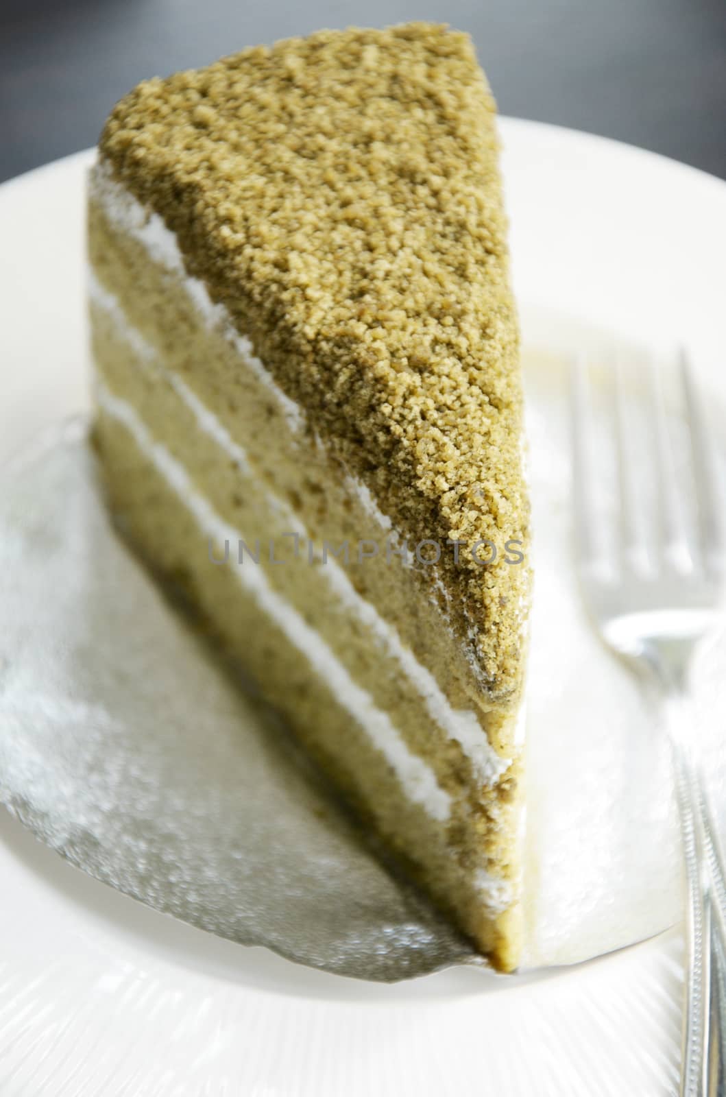 Matcha green tea cake in white dish