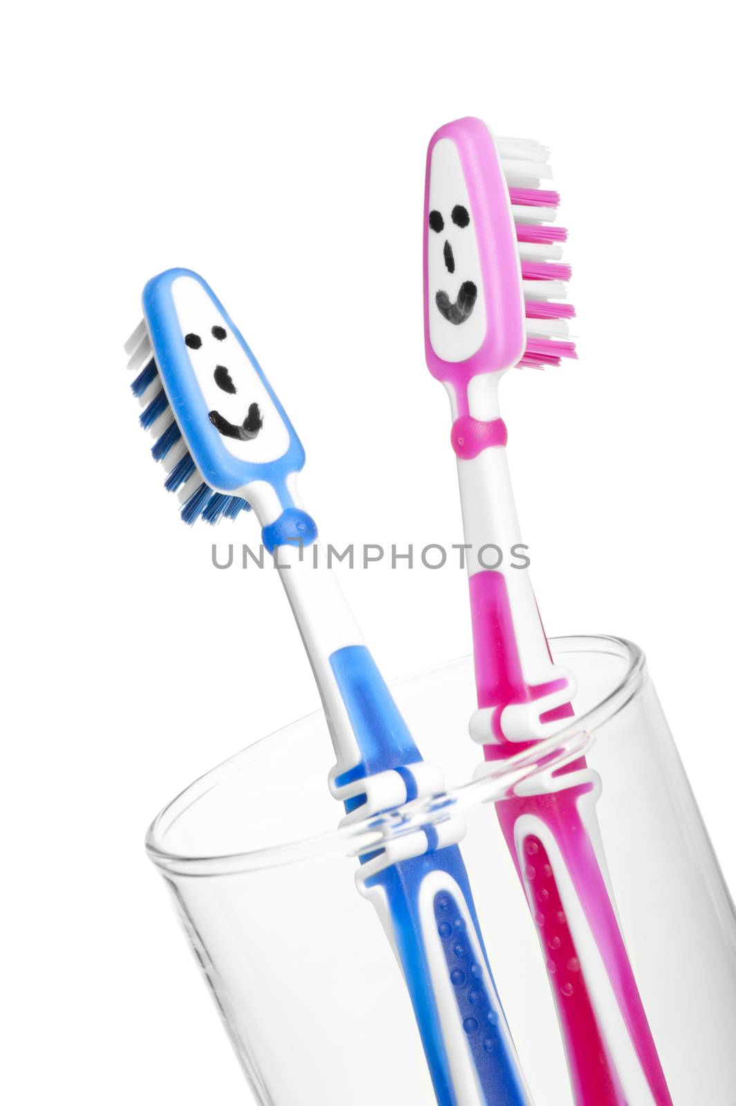 two smiling toothbrushes in a glass by kosmsos111