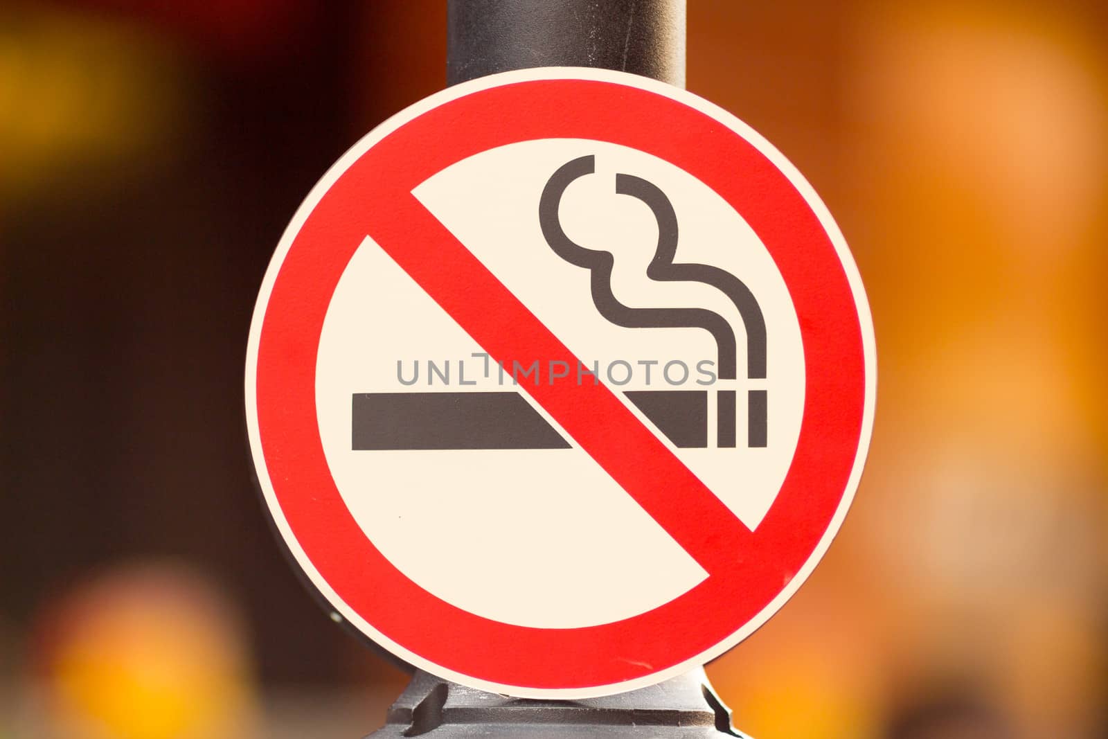 No smoking Sign On Pole in Public Place.