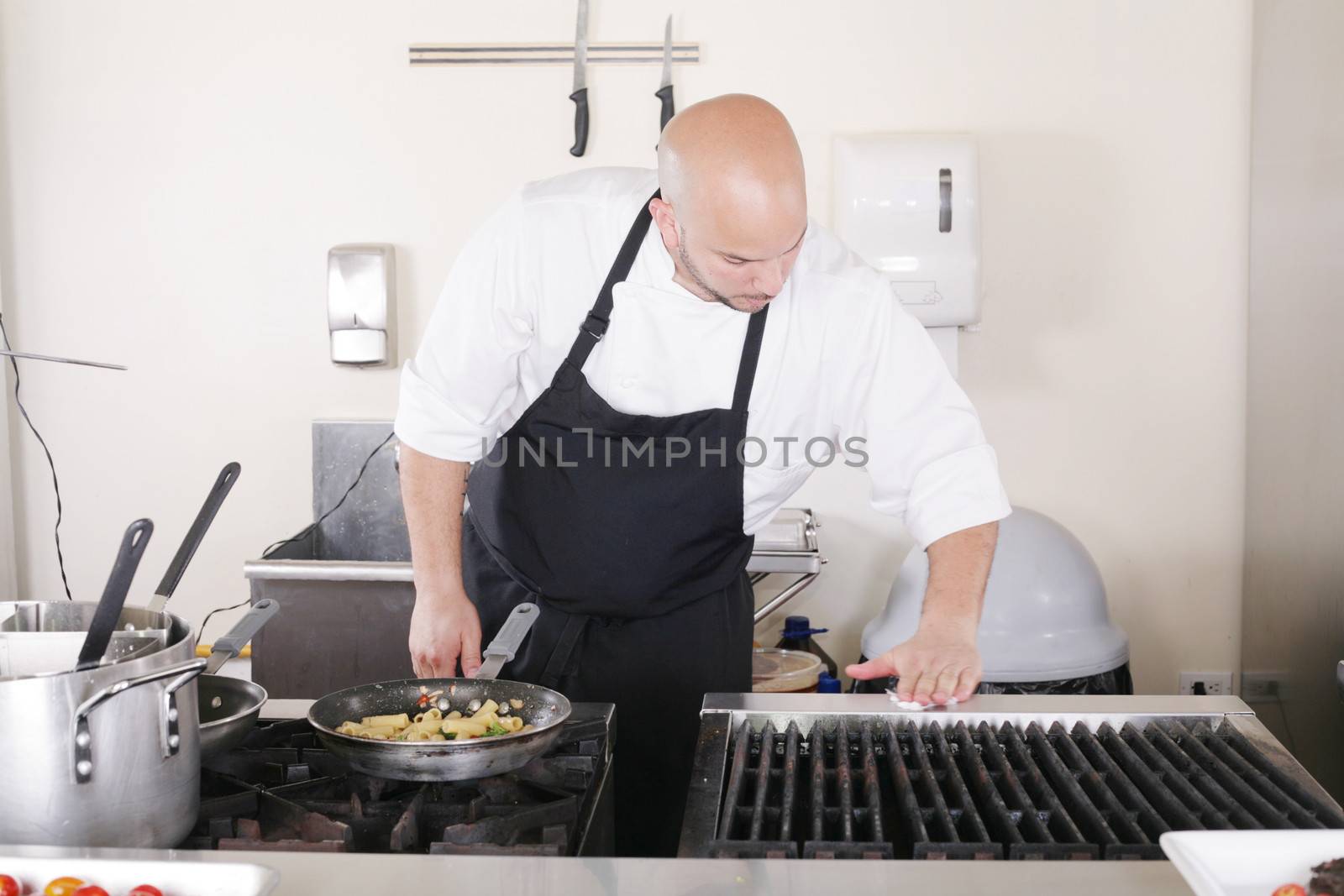 professional chef cleaning the kitchen