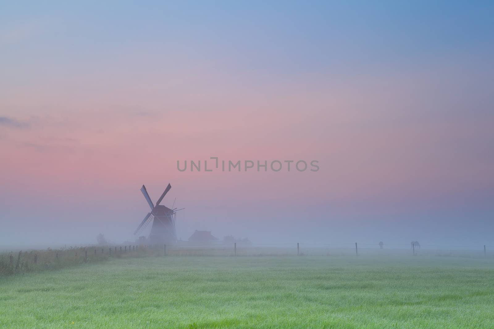 windmill silhouette over sunrise sky, Groningen, Netherlands