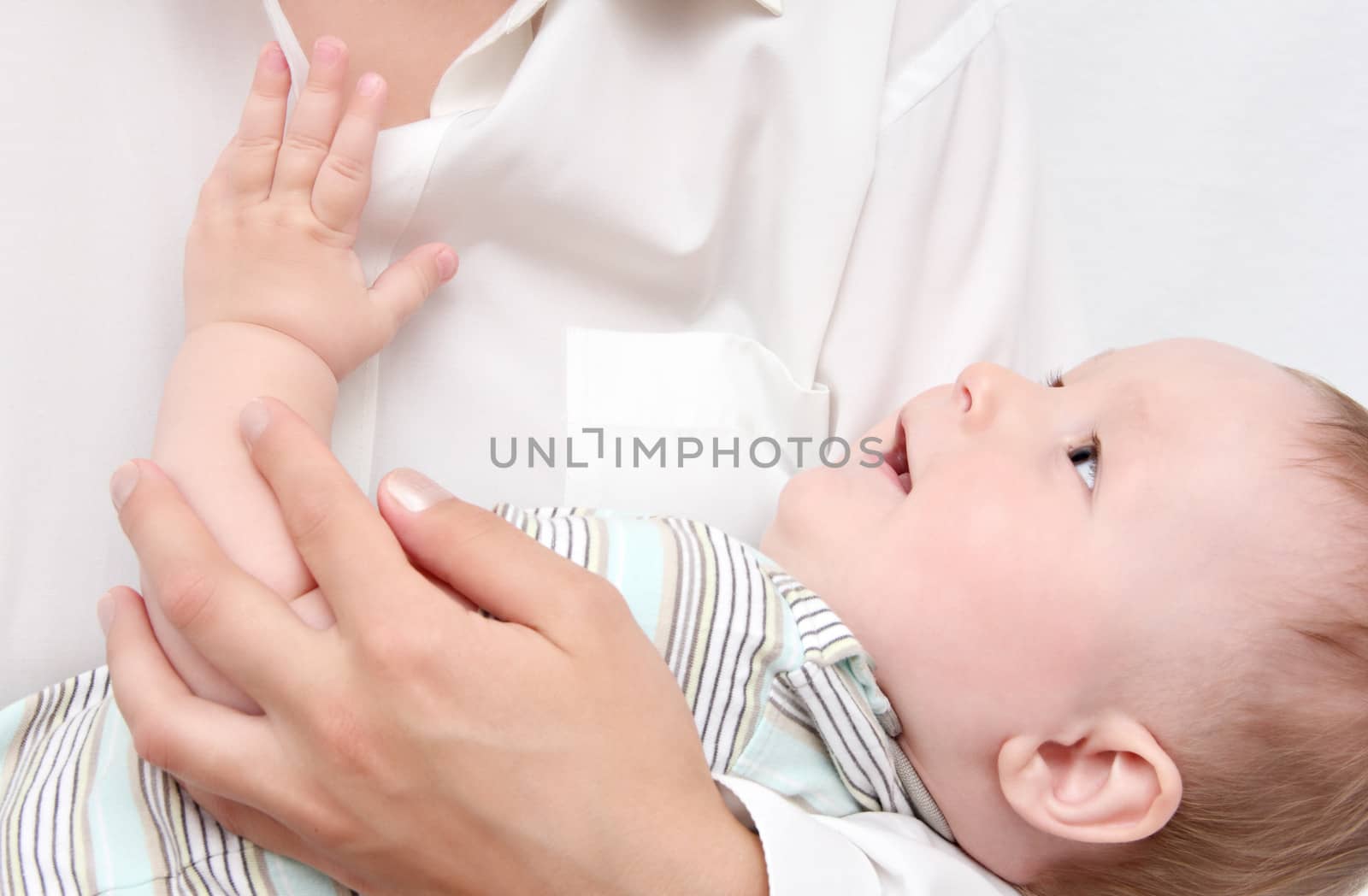 baby in mother's hands by NikolayK