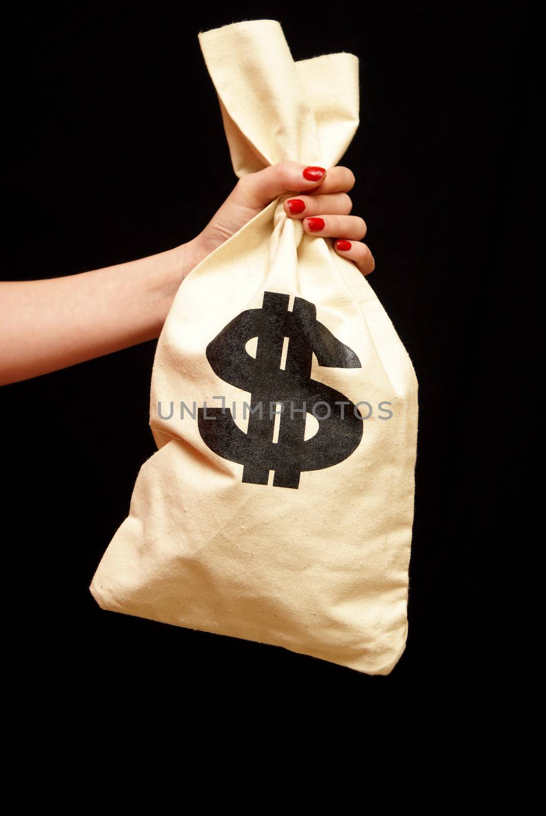 A woman grabs onto a large sum of cash in a bag.