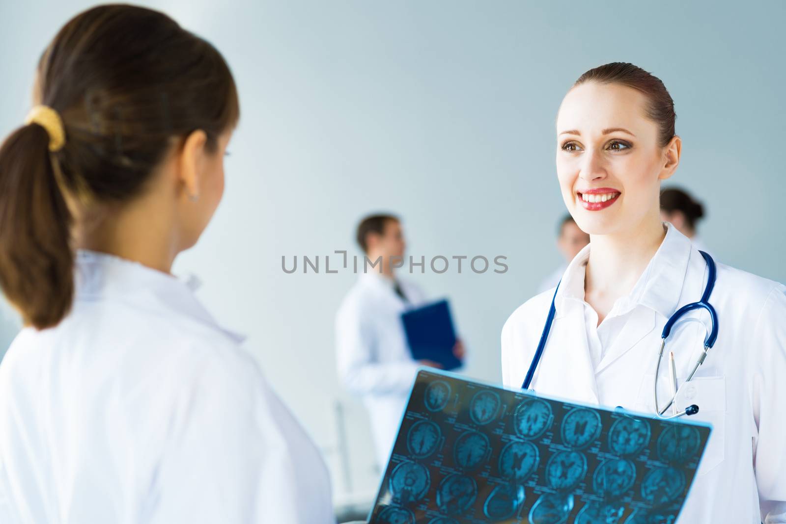 Doctor talking with a colleague, collaboration in medicine