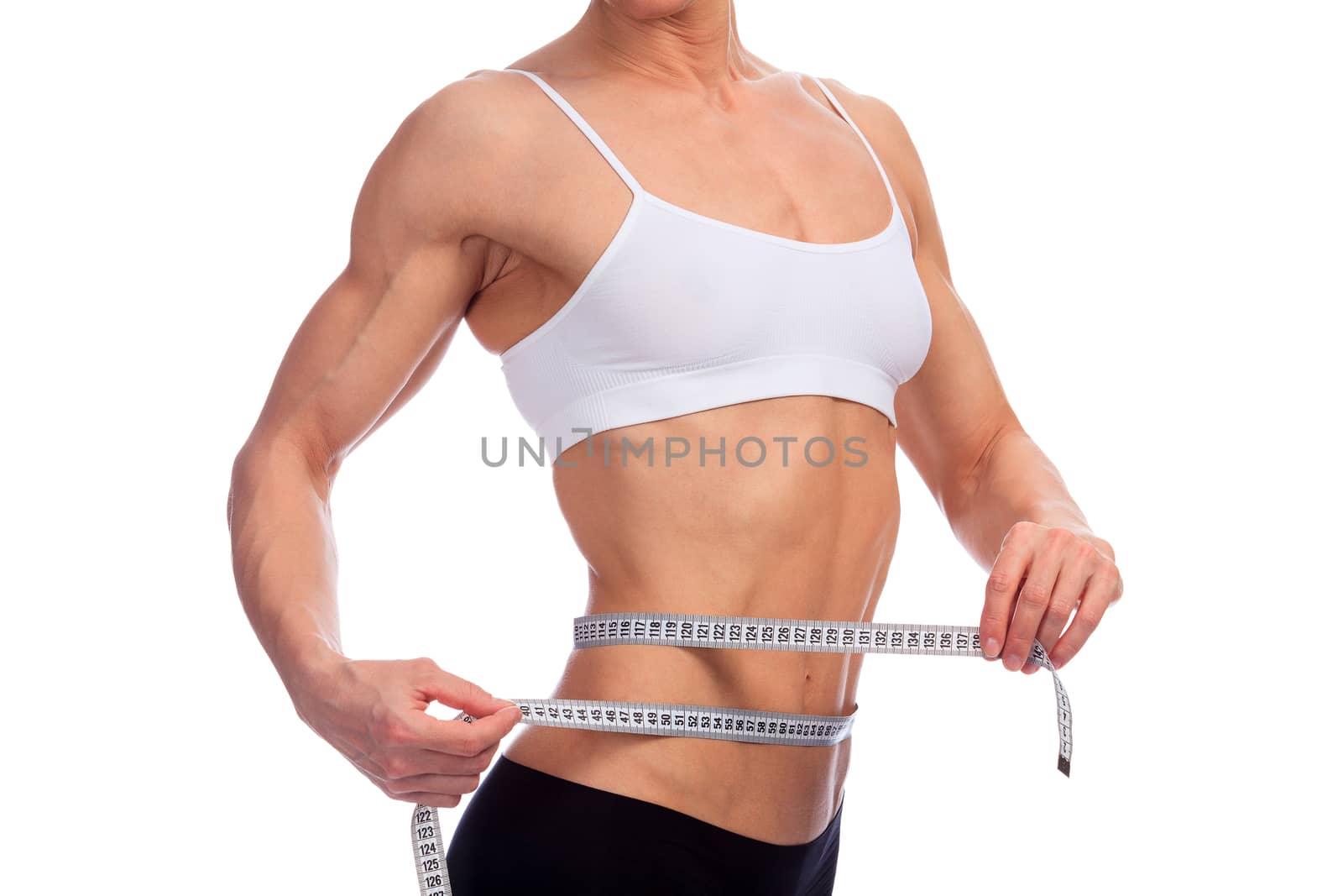 Woman measures her body, white background, copyspace