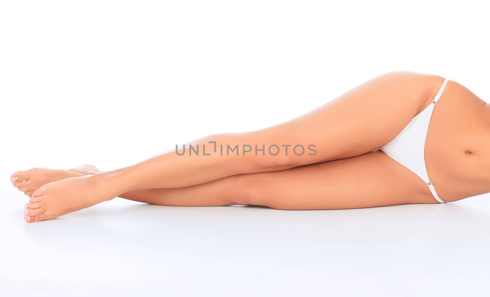Woman laying on the white floor. Copyspace.