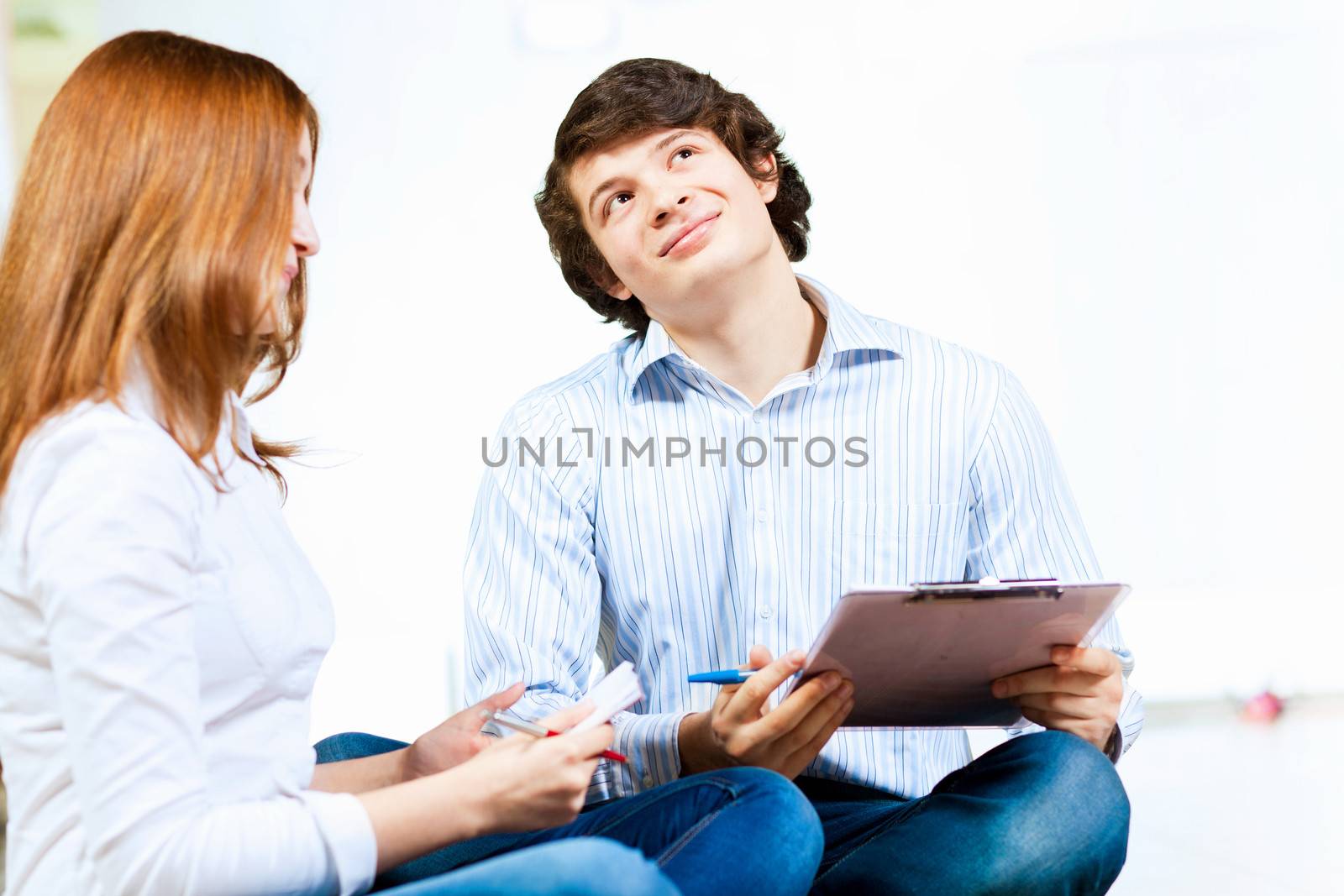 Image of two students discussing their work