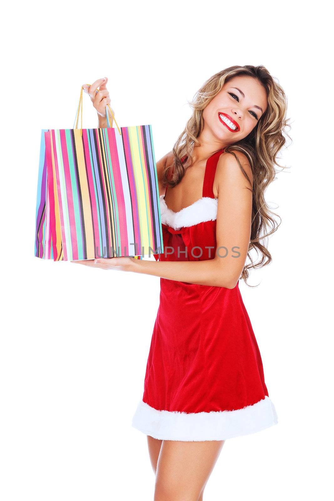 Girl in red dress with a shopping bag, white background, copyspace